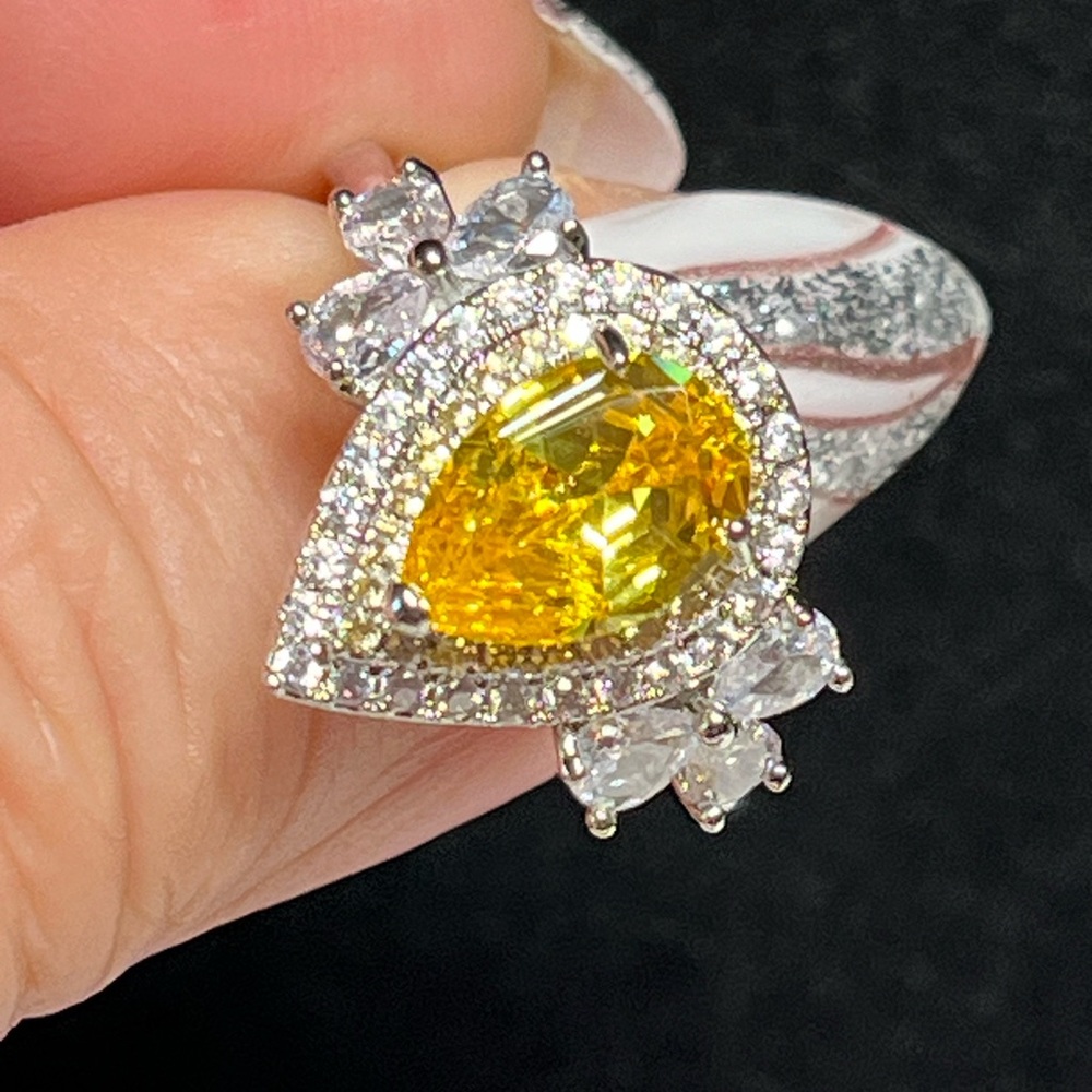 Ladies yellow pear shaped evening ring
